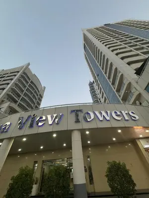 a view of a building with a sign on it at Marina Walk View Luxury 1BR close to JBR beach! in Dubai