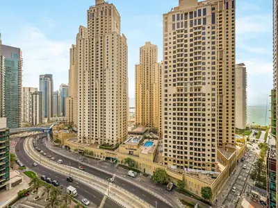 a view of a city with tall buildings at Modern 1BR Apt With Access to Jacuzzi, Sauna & Pool in Dubai