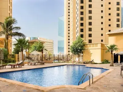 a large swimming pool in a city with buildings at Rimal - Upgraded Three Plus Kids Bedroom in JBR in Dubai