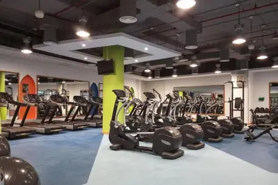 a gym with a bunch of tread machines in it at Rimal - Upgraded Three Plus Kids Bedroom in JBR in Dubai
