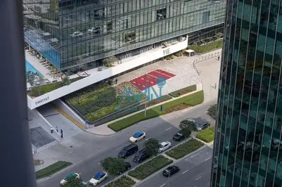an aerial view of a street in a city with buildings at Aspin Modern Studio Apartment in AHAD Residency in Dubai