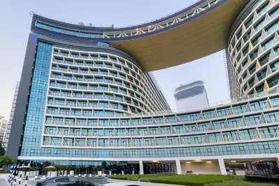 a large building with a lot of windows at Seven Palm Studio - Direct Beach Access- Rooftop Infinity Pool in Dubai