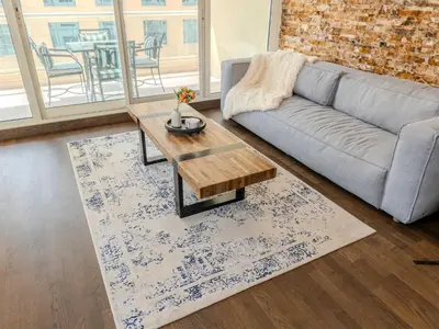 a living room with a couch and a coffee table at Luxury in Dubai Marina 1BR beside Vida Yacht Club in Dubai