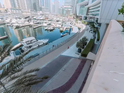 a view of a marina with boats in the water at Luxury in Dubai Marina 1BR beside Vida Yacht Club in Dubai