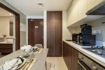 a kitchen with a counter top with a microwave at Airstay - Cozy 1BR - Canal View - Business Bay - Monthly Offer Available in Dubai