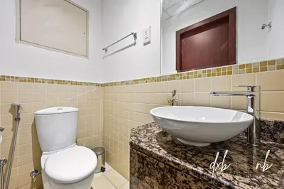 a bathroom with a sink and a toilet at Pistachio Pecan - Sea View - Luxury 1 BR Apartment at JBR Beach in Dubai