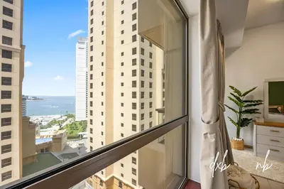 a balcony with a view of the ocean from a building at Pistachio Pecan - Sea View - Luxury 1 BR Apartment at JBR Beach in Dubai