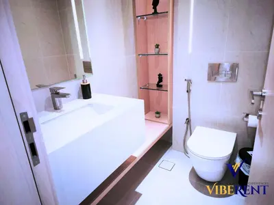 a bathroom with a sink and a toilet at Modern 6 sleeper JVC Rooftop pool, tennis court 10 min to Marina in Dubai