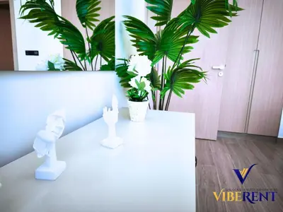 a white table in a room with plants at Modern 6 sleeper JVC Rooftop pool, tennis court 10 min to Marina in Dubai