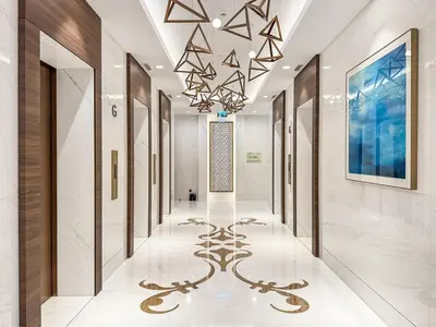 a hallway of a hotel with a chandelier at Deluxe, Elegant - 3BR - DT - Burj Khalifa View in Dubai