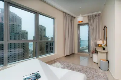 a bedroom with a large window with a city view at Great Location - Stunning Views - Scenic in Dubai