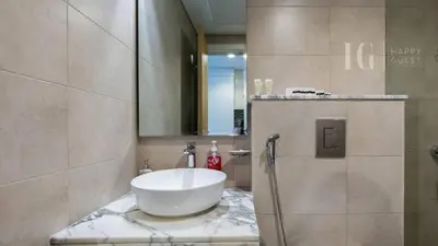 a bathroom with a sink and a mirror at Charming Studio with Cozy Vibes in Dubai