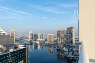 a view of a city with a river and buildings at Luxury Apartment in the Heart of the City in Dubai