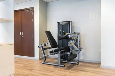 a room with a gym with a cardio machine at Luxury Apartment in the Heart of the City in Dubai