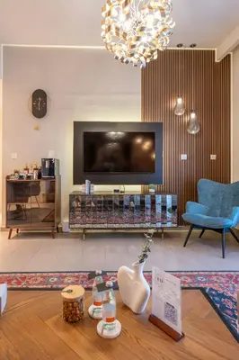 a living room with a large flat screen tv at Designer 1 Bedroom Apartments in Dubai Hills Estate in Dubai