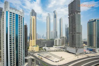 a view of a city with many tall buildings at Magnificent living at Downtown in Dubai