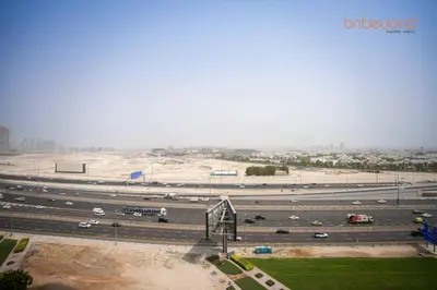a highway with cars on it in a city at Bnbeyond Contemporary Living in Business Bay in Dubai