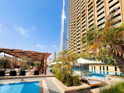 a view of the burj khalifa from a hotel with a pool at PVH - Emaar Fashion Avenue - 1BR Dubai Mall Access in Dubai