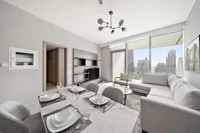 a living room with a couch and a table at FIRST CLASS 1BR Majestic Marina Views in Dubai