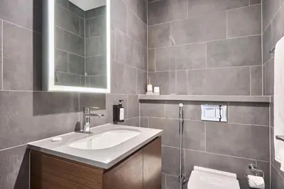 a bathroom with a sink and a toilet at STAY BY LATINEM Luxury 1BR Plus Study Holiday Home CB 3714 Near Burj Khalifa in Dubai
