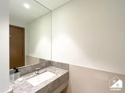 a bathroom with a sink and a mirror at Skyline Elegance, Fountain View 3BR in Downtown in Dubai