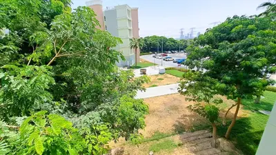 an aerial view of a street with trees and a building at DRUVYA HOLIDAY HOMES, Building No 194, Street No,10 Discovery Gardens, Close to Al Furjan Metro 3 minutes walkable in Dubai