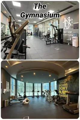 a gym with treadmills and exercise equipment in a building at The Haven Burj Khalifa View - 1BR Business Bay with Balcony&Pool in Dubai