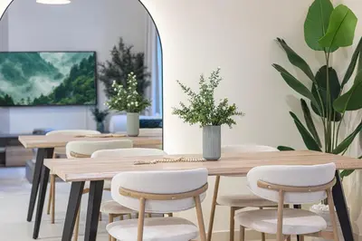 a conference room with wooden tables and chairs at The Haven Burj Khalifa View - 1BR Business Bay with Balcony&Pool in Dubai