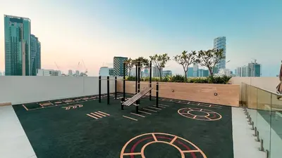 a playground on the roof of a building at Luxury Top Floor Apartment in JVC in Dubai