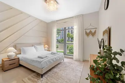 a bedroom with a bed and a large window at Lux Upscale Living Walk to Dubai Mall in Dubai