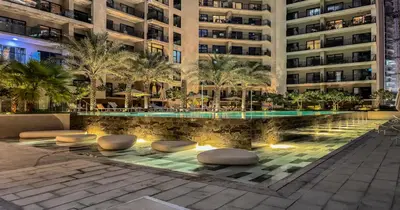 a swimming pool in the middle of a building at Savis Homes - Stylish 1 BR near Metro Station in Business Bay in Dubai