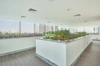 a large room with plants on the ceilings at STAY BY LATINEM Luxury 1BR Holiday Home CB 3113 Near Burj Khalifa in Dubai