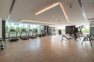 an empty gym with exercise equipment in a building at GuestReady - 1 BHK | 5min to Butterfly Garden in Dubai