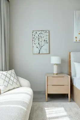 a bedroom with a bed and a table with a lamp at Star of Dubai Marina 2 Br 5 Guests in Dubai