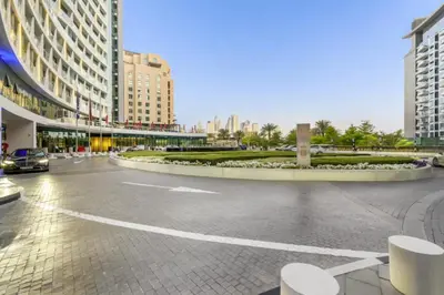 an empty street in a city with tall buildings at Wonderful Stay at 7 Palm - Rooftop Infinity Pool - Direct Beach Access - Brand New Luxury Apartments in Dubai