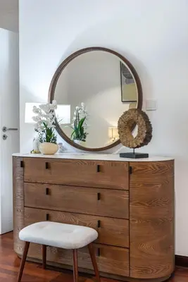 a mirror on top of a dresser in a room at GlobalStay The Residences Tower 1 Apartments Downtown Dubai in Dubai