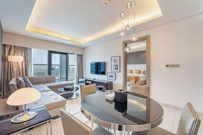 a living room with a couch and a table at Stylish Stay - 1 Bedroom - High Floor in Dubai