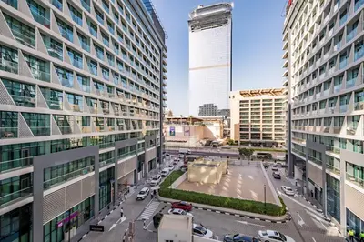 a view of a street in a city with tall buildings at LUX Infinity Pool with GYM, Private Beach Studio in Dubai