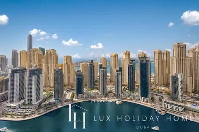 an aerial view of a city with a bridge at LUX The Vida Marina Residence in Dubai