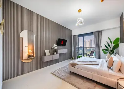 a bedroom with a large bed and a mirror at Act One Luxury 2BR Front-Row Burj & Fountain Views in Dubai