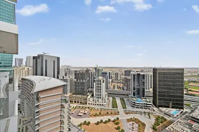 an aerial view of a city with tall buildings at Sylish Studio with Balcony Views Near Dubai Mall in Dubai