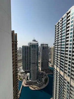 an aerial view of a city with tall buildings at Modern 1BR with city views large space in Dubai
