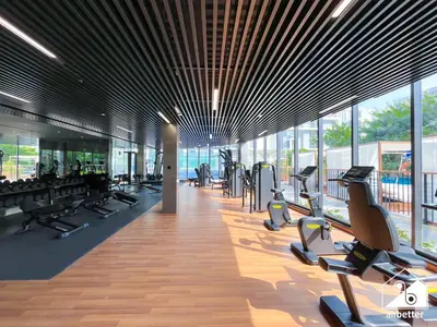 a gym with treadmills and ellipticals in a building at Spacious 1-BR with Balcony & Leisure Facilities in Dubai