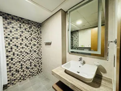 a bathroom with a sink and a shower at Stylish One Bed Apartment near Downtown in Dubai