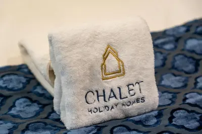 a towel with the phrase chalk holiday modes on it at DAMAC MAISON DISTINCTION - Burj Khalifa View, Fee Parking in Dubai