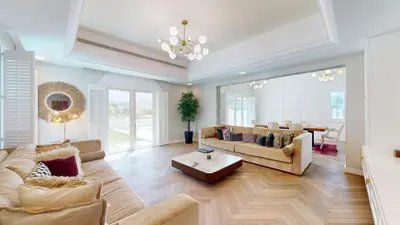 a living room with a couch and a table at Vacationer l Family Villa with Private Pool, Private Garden in Dubai