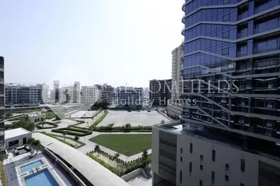 an aerial view of a city with a building at Bloomfields Marquis 2020 in Arjan in Dubai