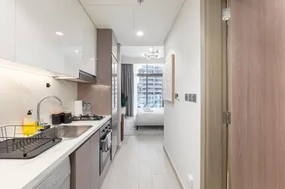 a kitchen with a sink and a counter top at Downtown-Close Studio by Czech-In in Dubai