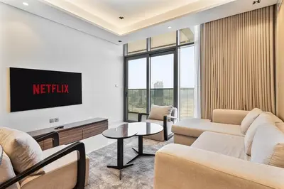 a living room with two couches and a tv at Relaxing 2BR in Business Bay Mins to Burj Khalifa in Dubai