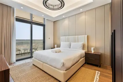 a bedroom with a large bed and a large window at Relaxing 2BR in Business Bay Mins to Burj Khalifa in Dubai